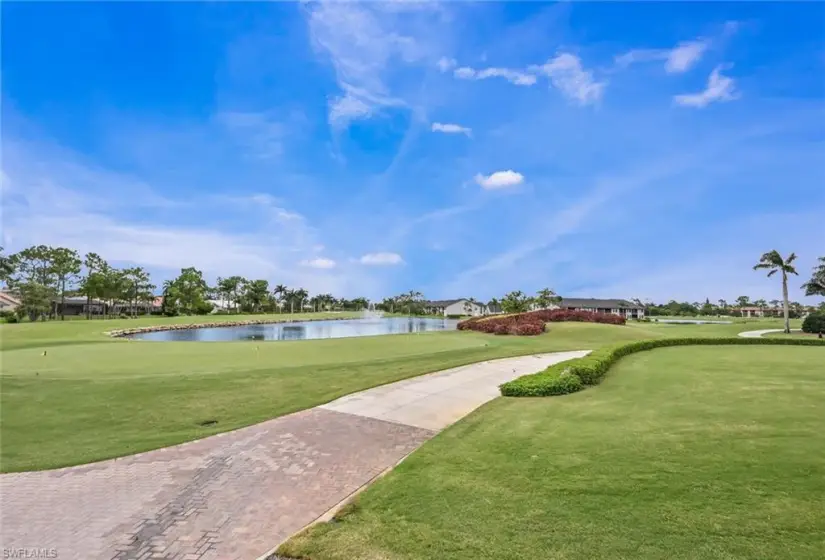 View of nearby features featuring a lawn and a water view