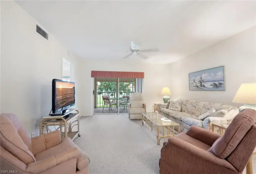 Living room featuring ceiling fan