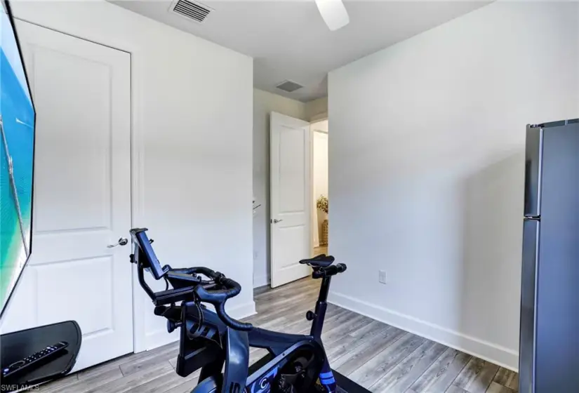 Exercise area featuring hardwood / wood-style floors