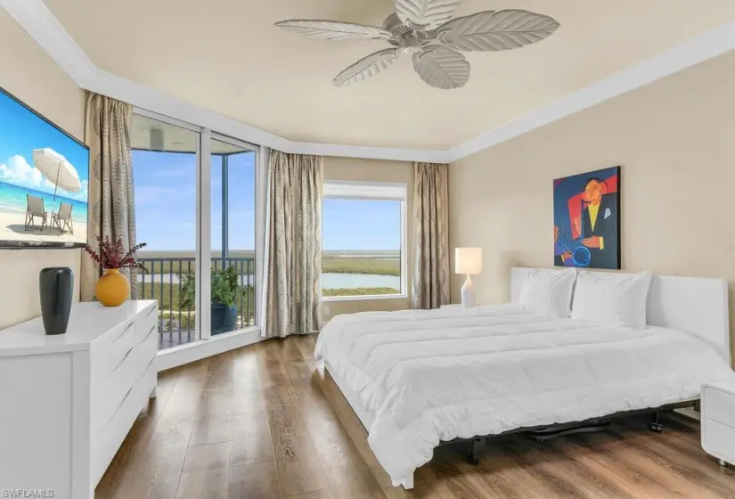 Bedroom featuring crown molding, ceiling fan, and hardwood / wood-style floors