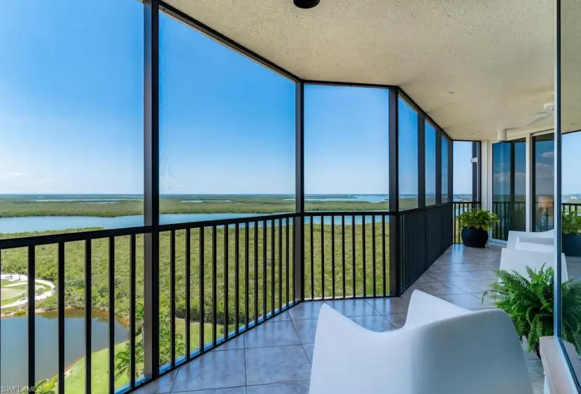 Unfurnished sunroom featuring a water view