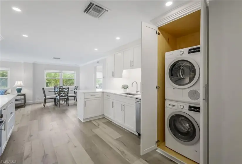 Laundry closet with stack unit Bosch w/d.